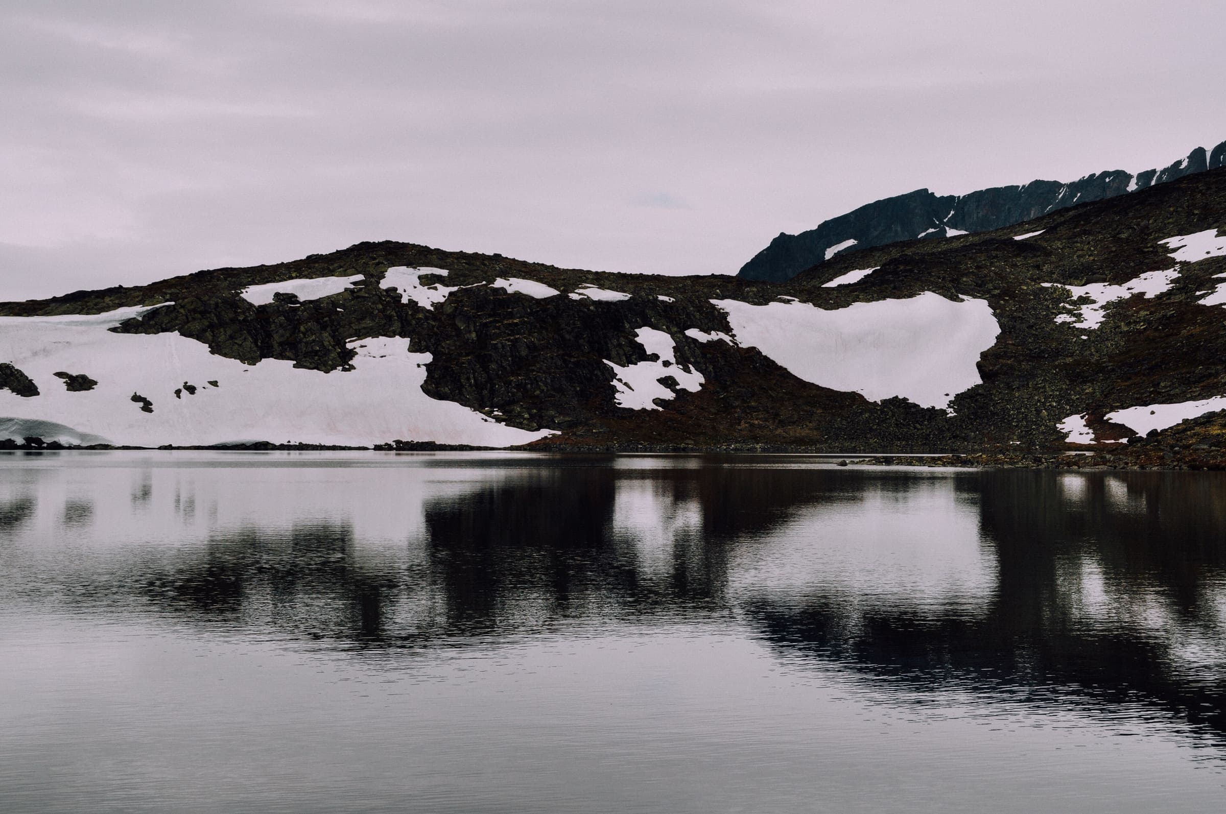 Besseggen ridge reflecting in a lake, Norway