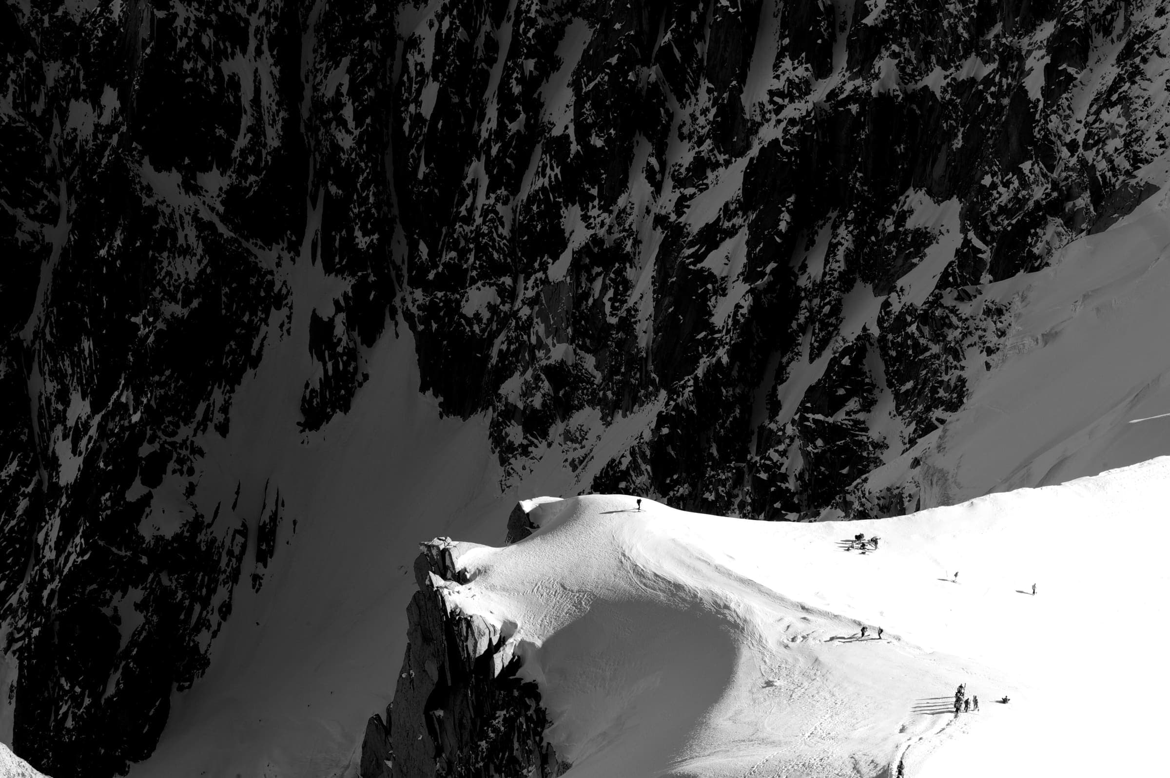 Climber on a high mountain edge