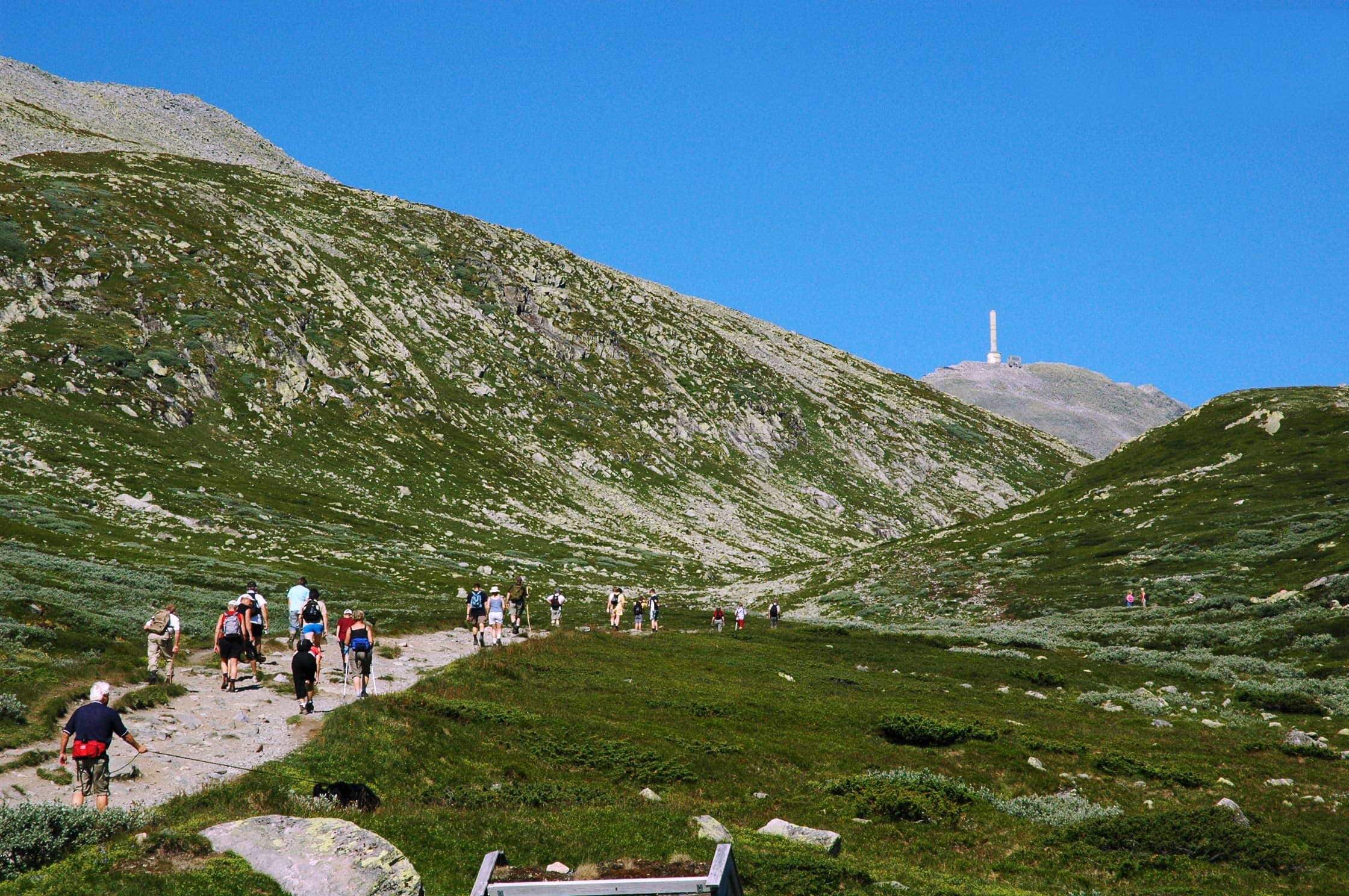 Walkers on a mountain path toward Gaustatoppen, Norway